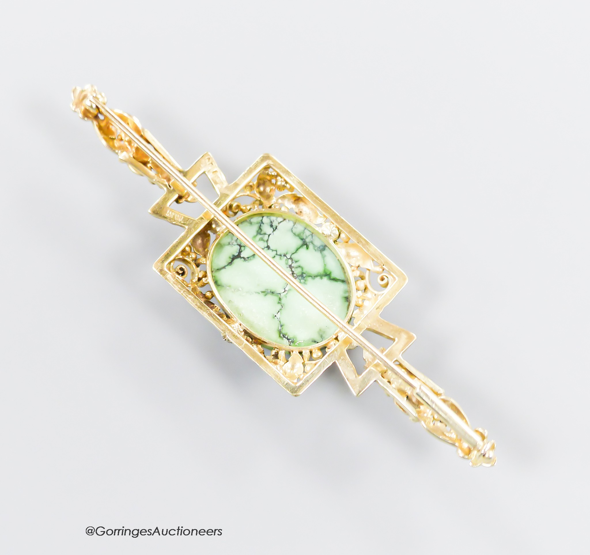 A modern 9ct gold, cabochon turquoise and four stone rose cut diamond chip set bar brooch, 67mm, 9.5 grams.